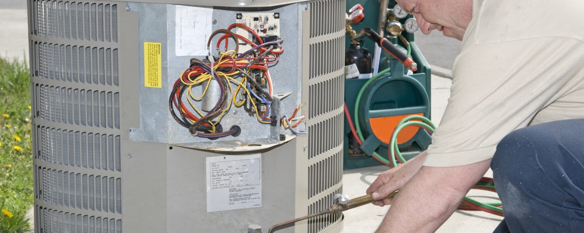 AC Repairman Welds Connector on Replacement Air Conditioner - AC Repair Spokane