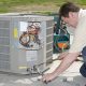 AC Repairman Welds Connector on Replacement Air Conditioner - AC Repair Spokane