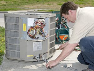 AC Repairman Welds Connector on Replacement Air Conditioner - AC Repair Spokane